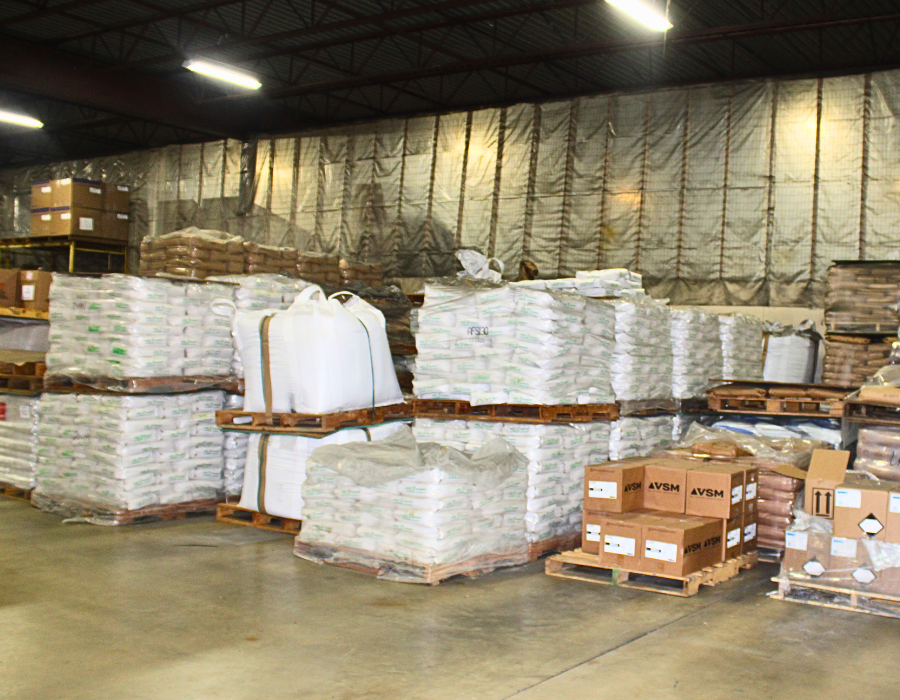 Pallets of Green Diamond Sand and other foundry supplies inside a warehouse