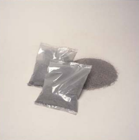 Two bags of grey Joy-mark hot topping compound